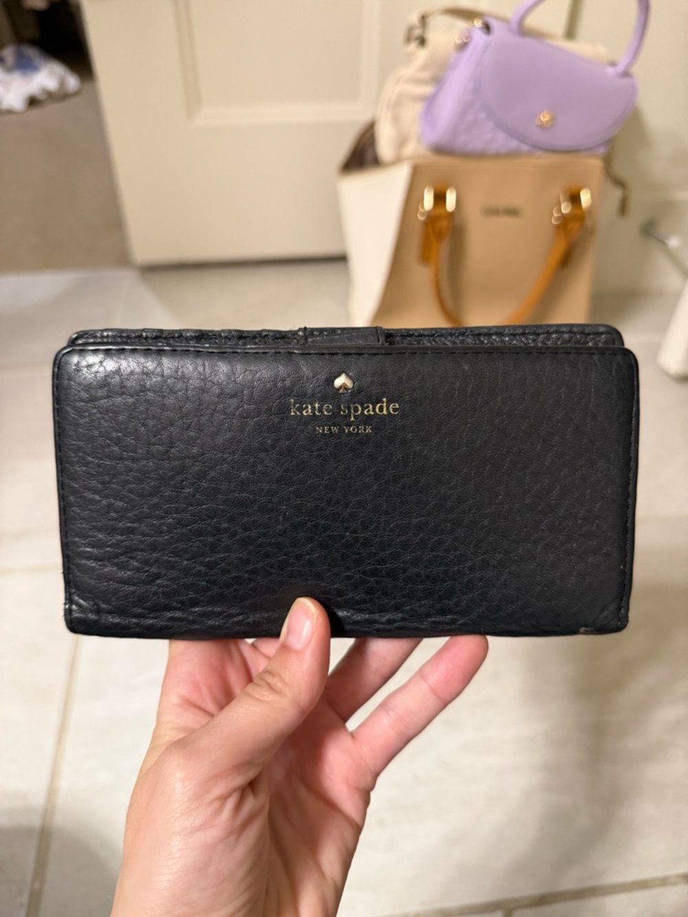 kate spade black pebbled leather continental wallet with gold logo